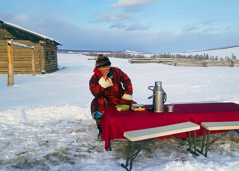 Lunch break at snow white steppe